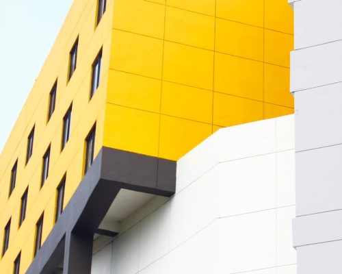 white and yellow high-rise building